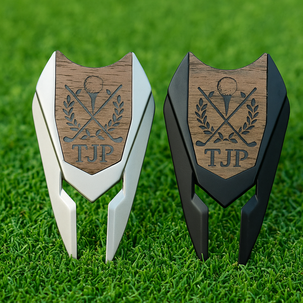 Two wooden golf divot tools with 'TJP' engraved on a grass background