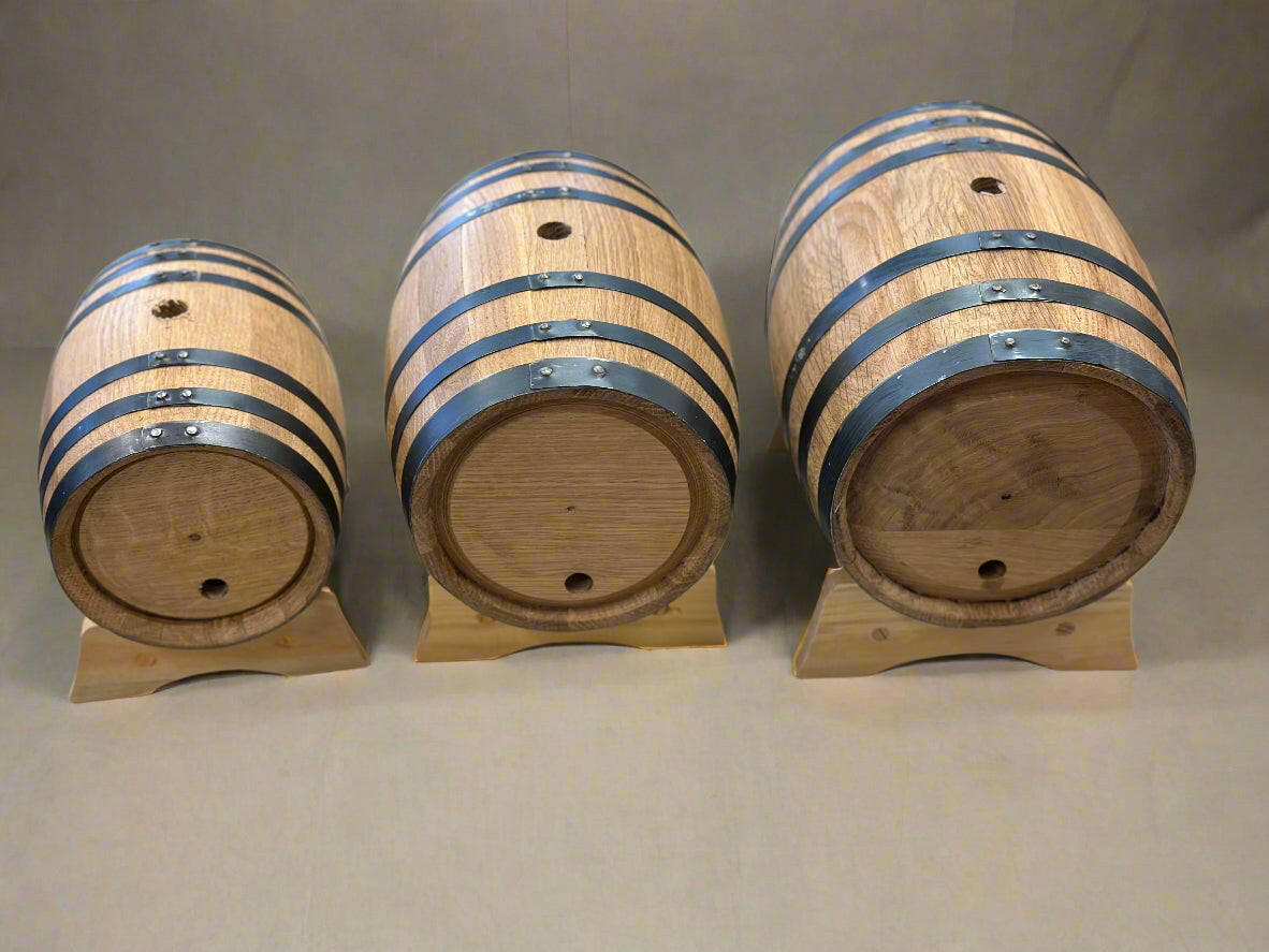 Three different sizes of wooden barrel