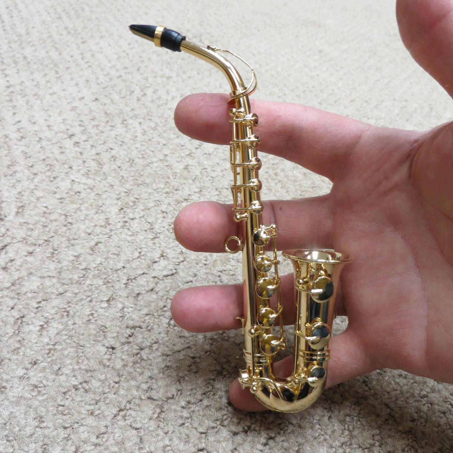 Embossed Miniature Saxophone.